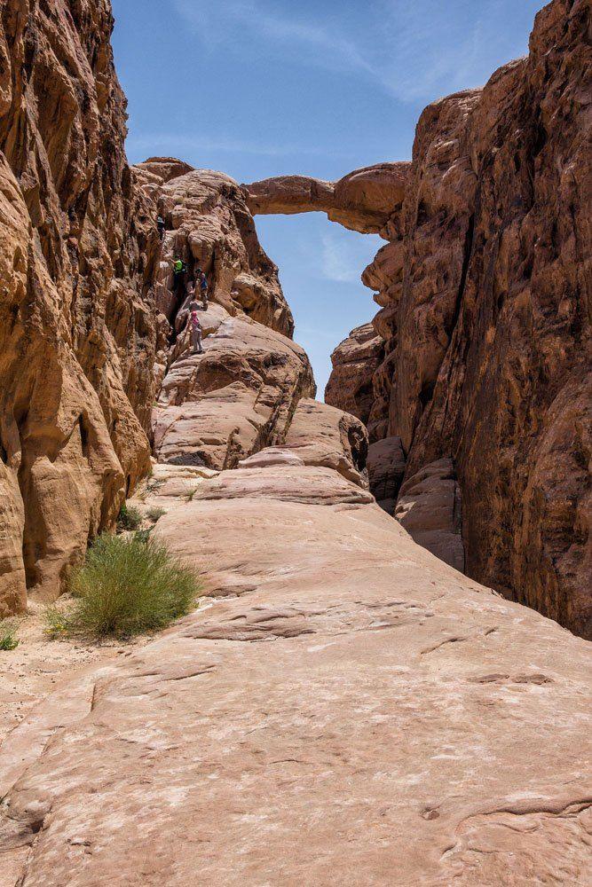 The Jebel Burdah rock bridge spanning a sandstone canyon